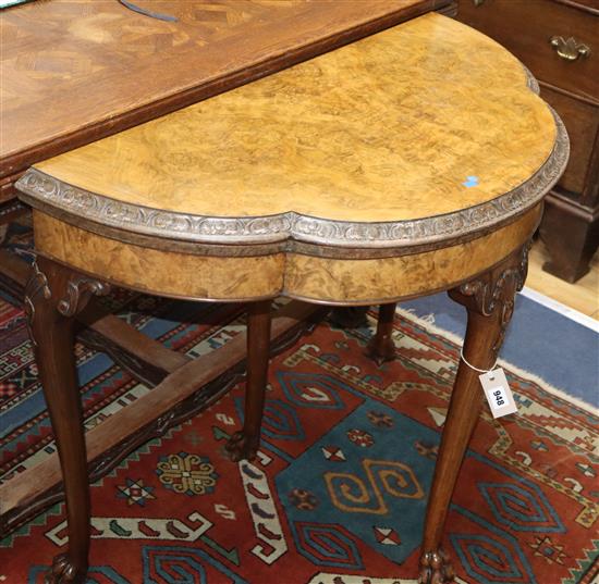 A Queen Anne style walnut demi-lune card table W.91cm